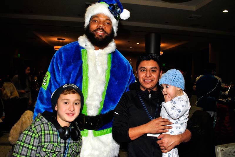 Seahawks Defensive End Michael Bennett with Bellevue LifeSpring family