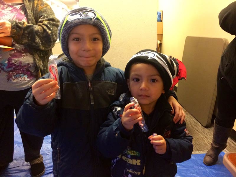 Holiday Adopt-A-Family kids with Seahawks hats